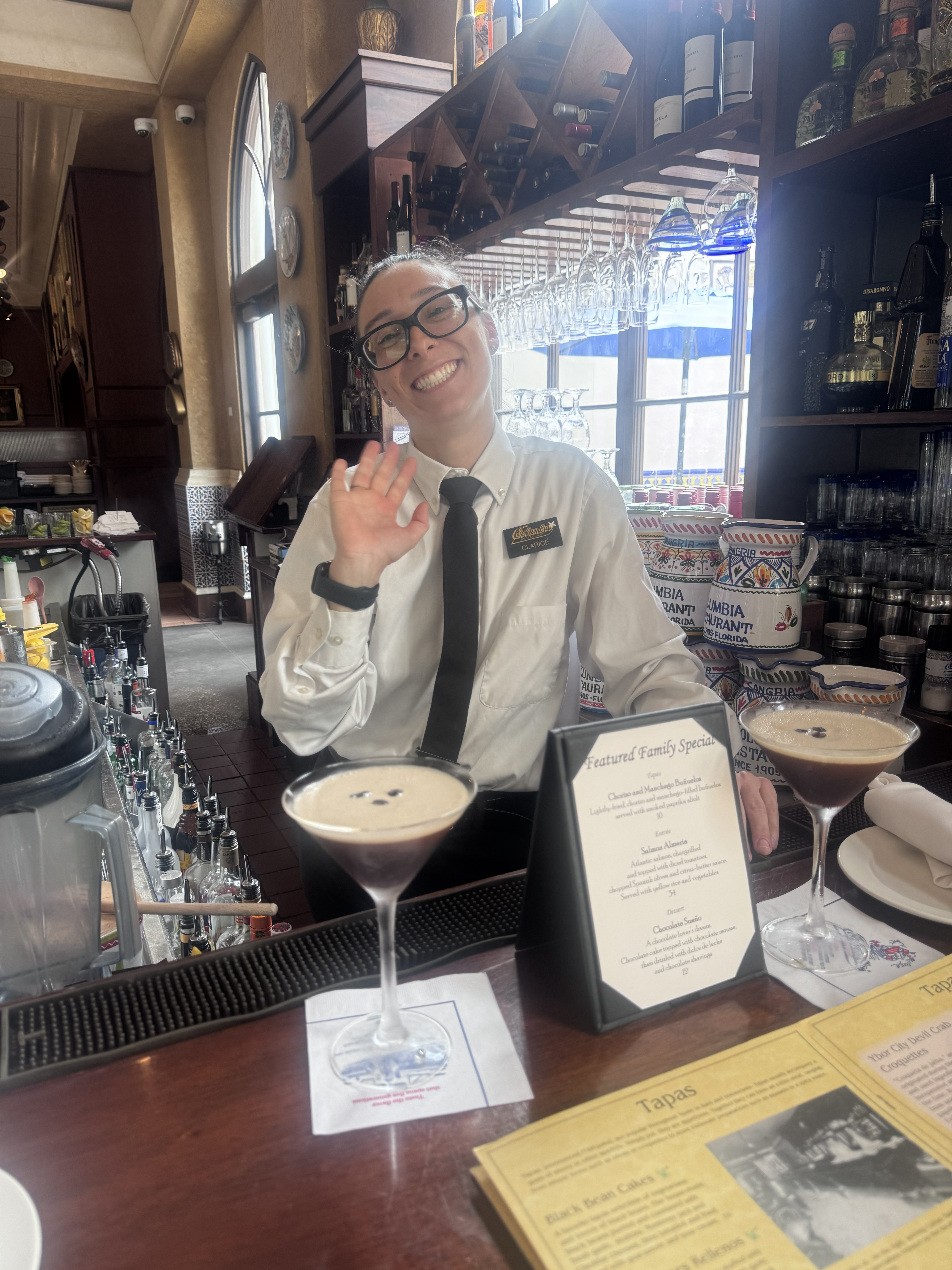 Clarice serving up a properly foamed espresso martini with a smile